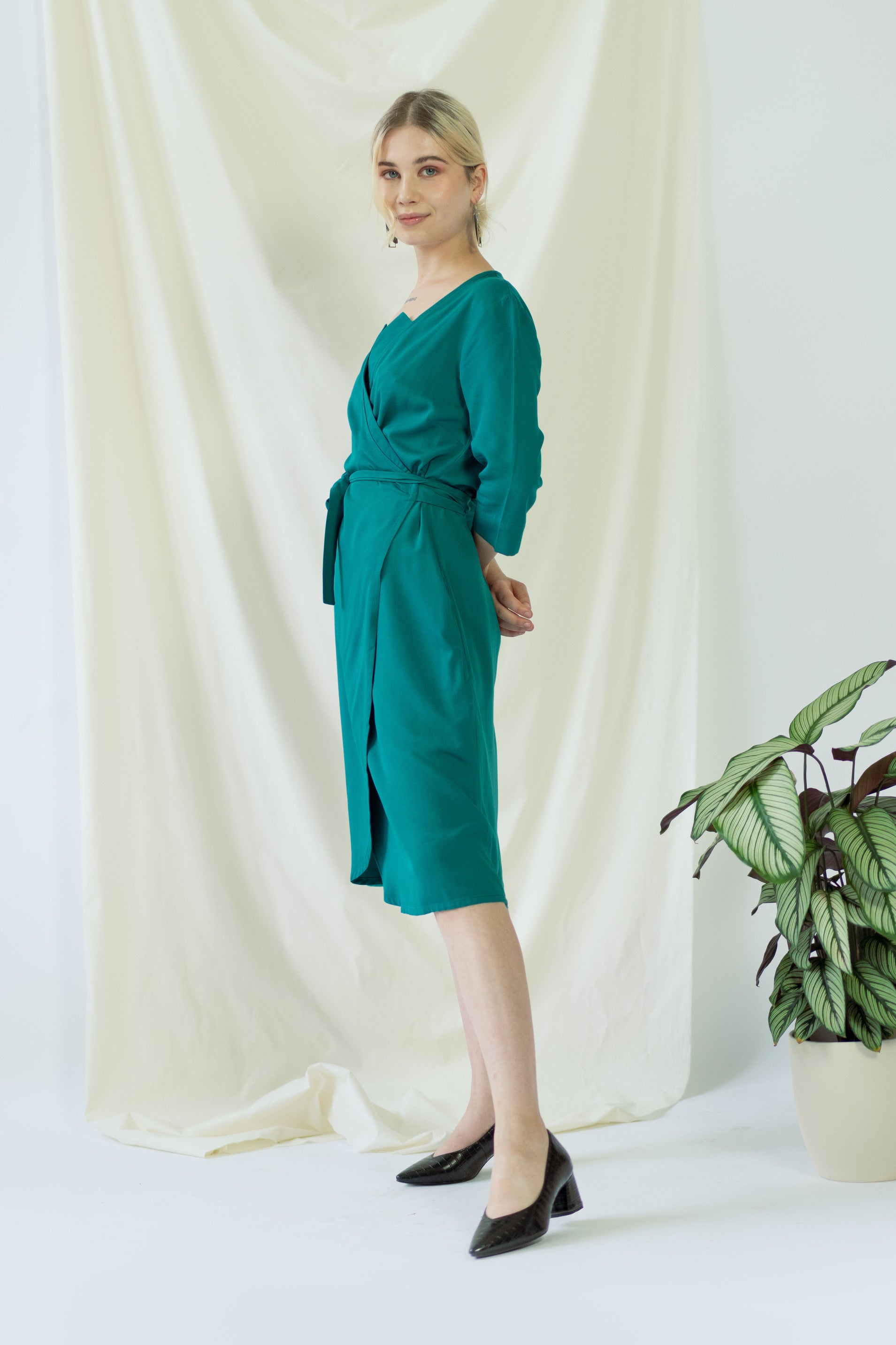 Sustainable and Ethical Knee length Work Wrap Dress in Green with pockets AYANI